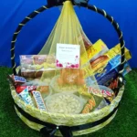 Anniversary Gift Basket Pakistan with chocolates, biscuits, dry fruits, oranges, and greeting card